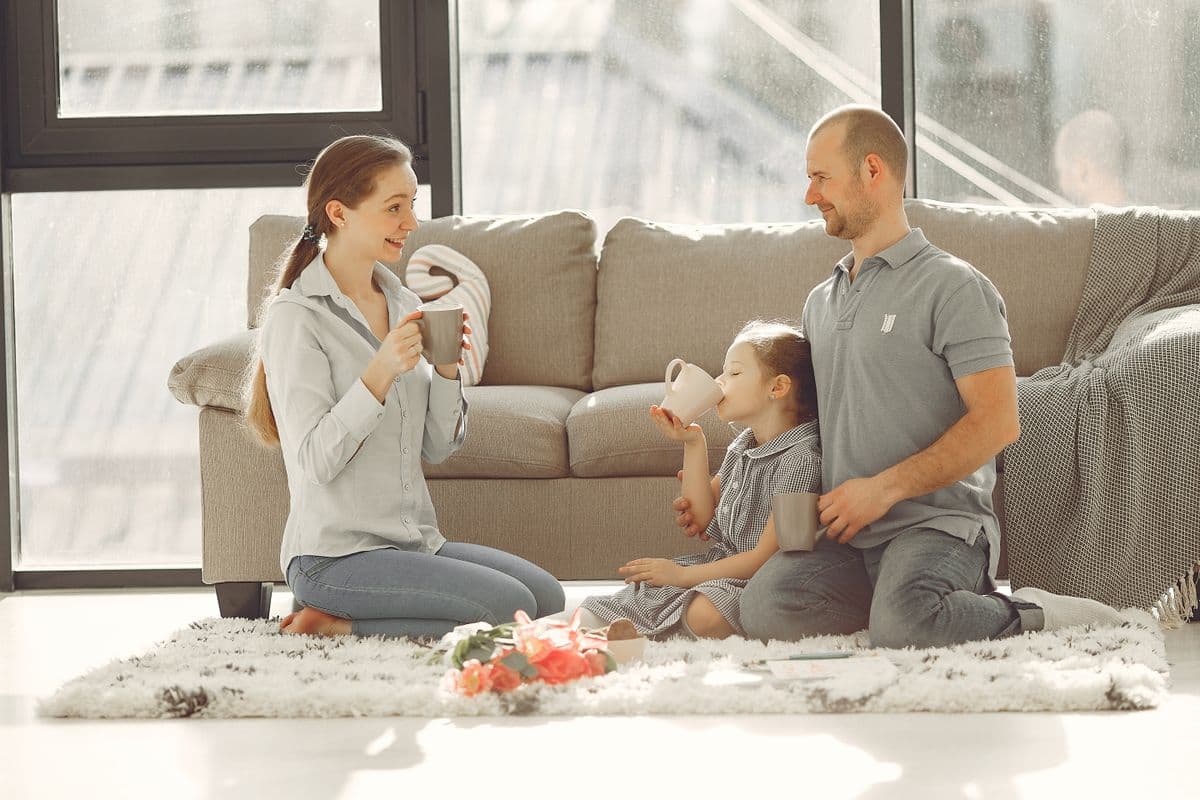 Happy homeowner enjoying a bright, freshly cleaned home