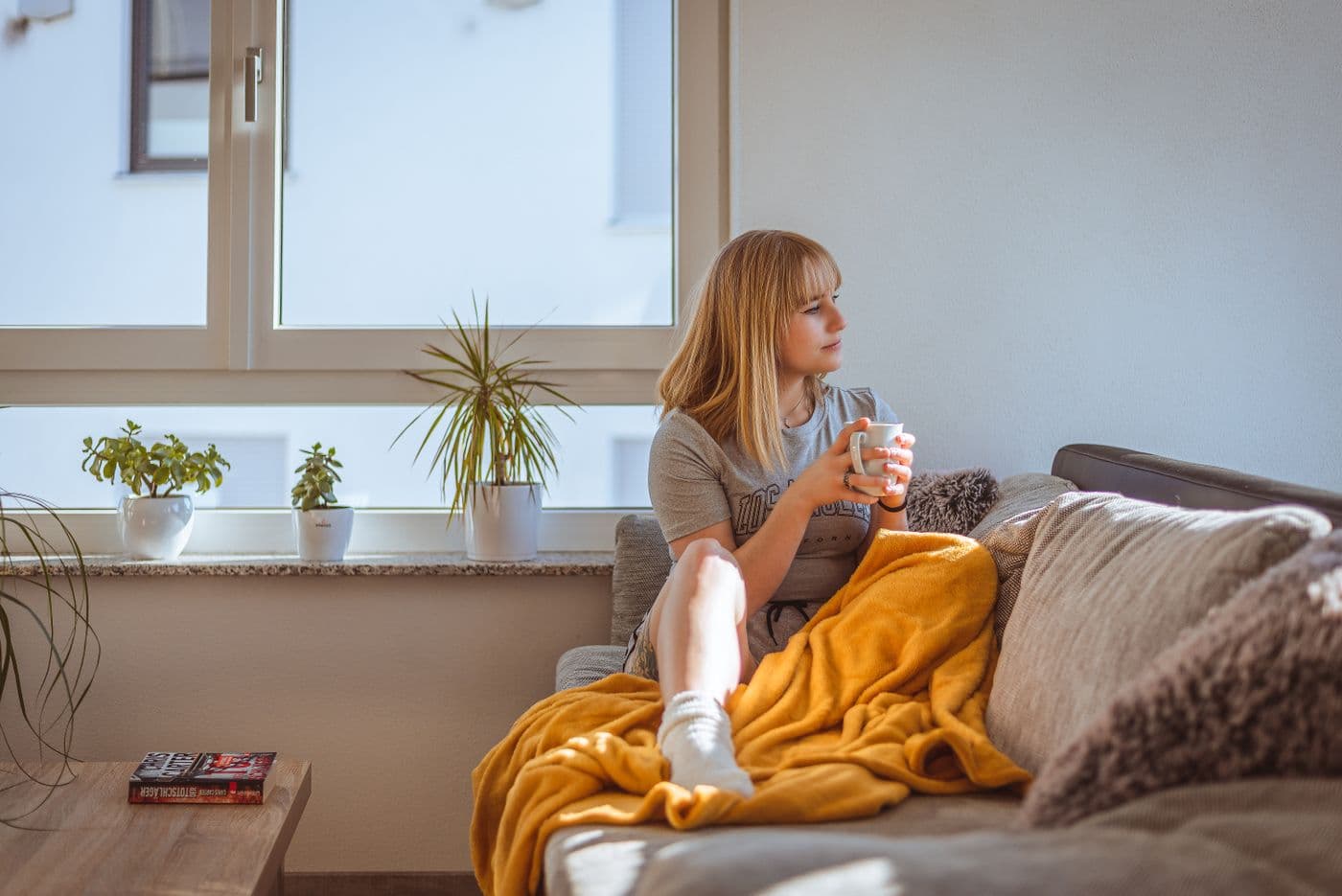 Homeowner relaxing with a coffee in her freshly cleaned living room